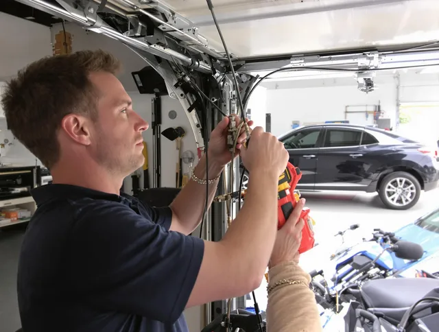 Coconut Creek Garage Door Repair safety certified technician performing cable replacement in Coconut Creek