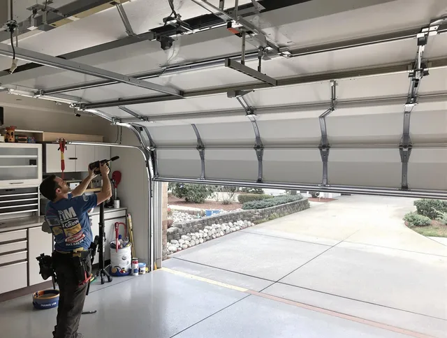 Garage door track repair service by Coconut Creek Garage Door Repair in Coconut Creek
